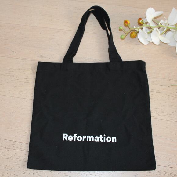 REFORMATION Canvas Tote Bag in Black with White Logo Print - Picture 1 of 7